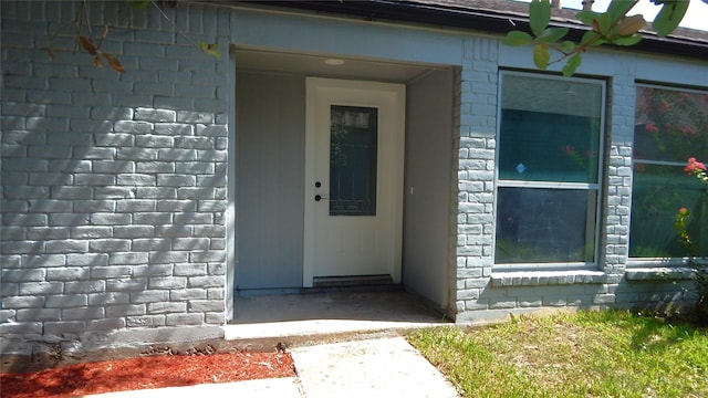 property entrance featuring stone siding