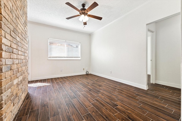 unfurnished room with ornamental molding, dark wood finished floors, a textured ceiling, and a ceiling fan