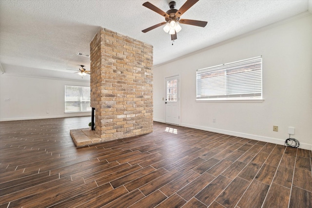 unfurnished living room with a ceiling fan, wood finish floors, and crown molding