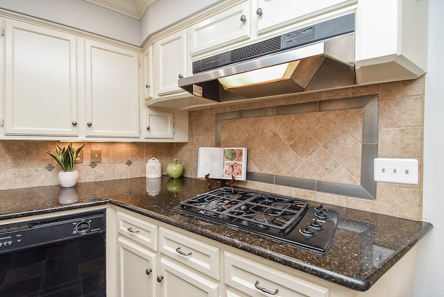 kitchen featuring dark stone counters, black appliances, decorative backsplash, and under cabinet range hood