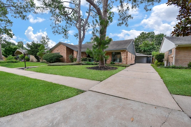 single story home with a front yard and brick siding