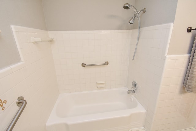 full bath featuring a wainscoted wall, shower / tub combination, and tile walls