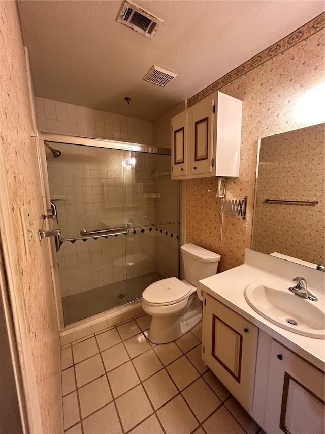 bathroom featuring visible vents, vanity, toilet, and wallpapered walls