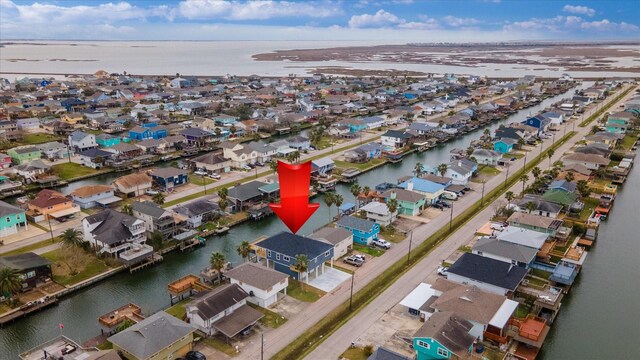 birds eye view of property featuring a residential view and a water view