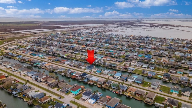 drone / aerial view featuring a residential view and a water view