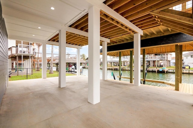 view of patio / terrace with a dock and a water view