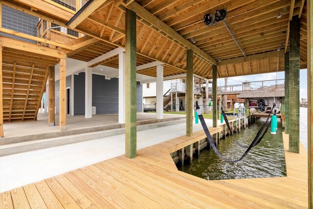 view of dock with stairway and a water view