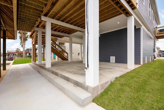view of patio with stairs and visible vents