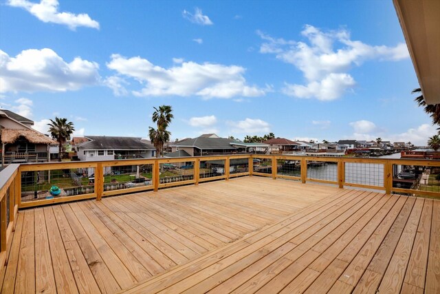 wooden deck featuring a water view