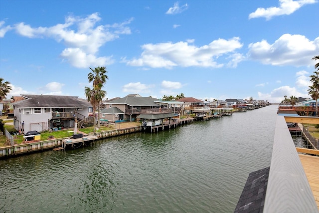 view of dock featuring a water view and a residential view