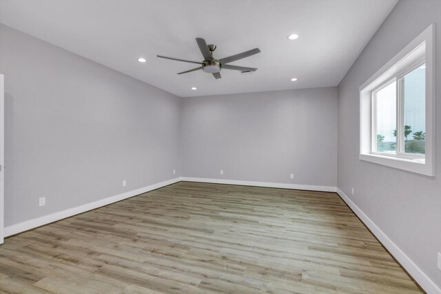 unfurnished room featuring light wood finished floors, ceiling fan, baseboards, and recessed lighting