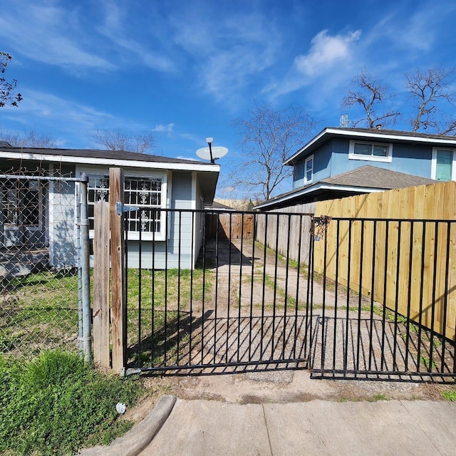 view of gate with fence