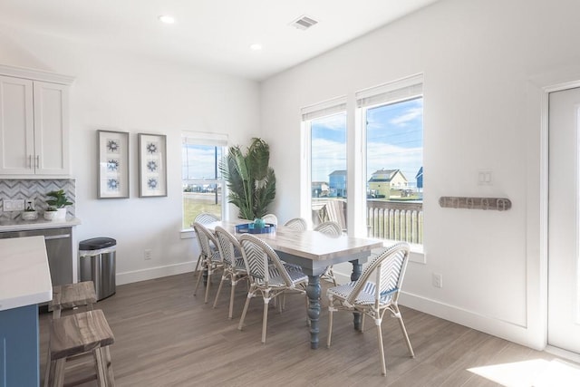 dining area featuring recessed lighting, wood finished floors, visible vents, and baseboards