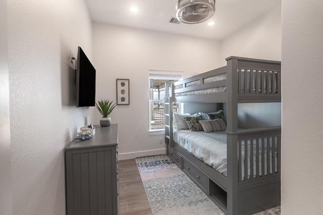 bedroom featuring recessed lighting, visible vents, baseboards, and wood finished floors