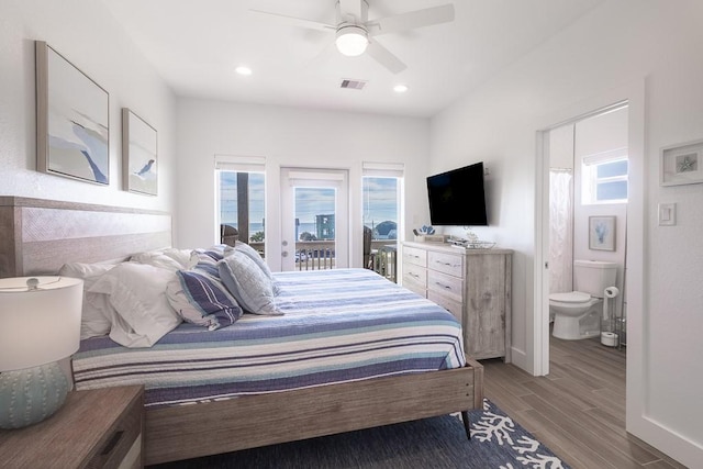 bedroom featuring access to exterior, visible vents, a ceiling fan, connected bathroom, and wood finished floors