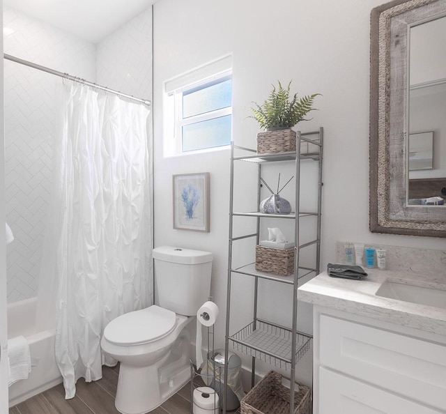 bathroom featuring vanity, wood finished floors, shower / bath combination with curtain, and toilet