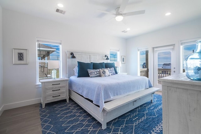 bedroom with access to exterior, visible vents, baseboards, and multiple windows