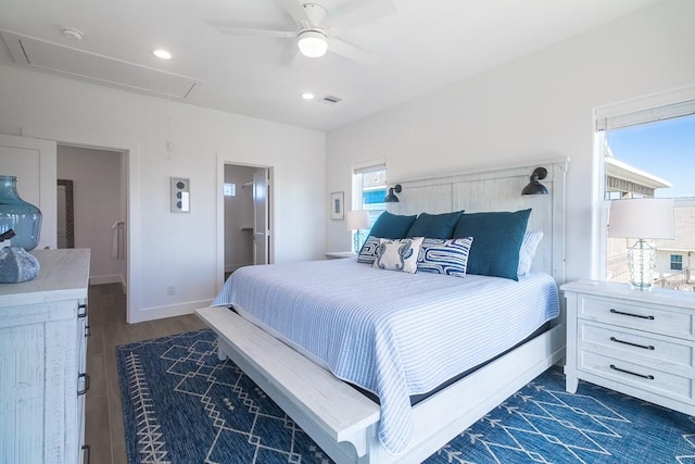 bedroom featuring dark wood-style flooring, recessed lighting, attic access, ceiling fan, and baseboards