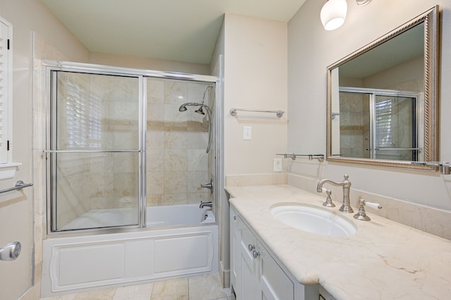 full bathroom featuring shower / bath combination with glass door, tile patterned floors, and vanity