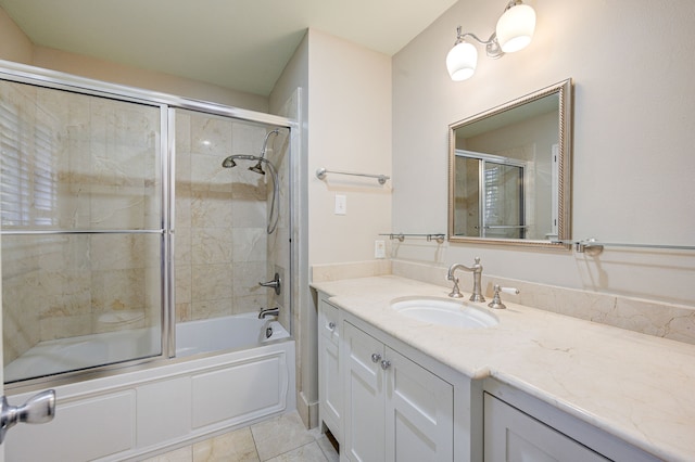 full bathroom featuring tile patterned flooring, enclosed tub / shower combo, and vanity