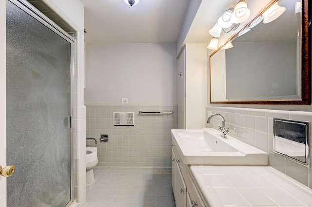 full bathroom with toilet, a wainscoted wall, a shower with shower door, vanity, and tile walls