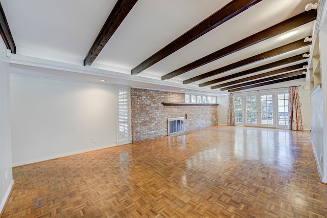 unfurnished living room featuring a fireplace, baseboards, beam ceiling, and french doors