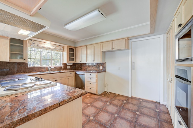 kitchen featuring a sink, appliances with stainless steel finishes, backsplash, dark stone counters, and glass insert cabinets