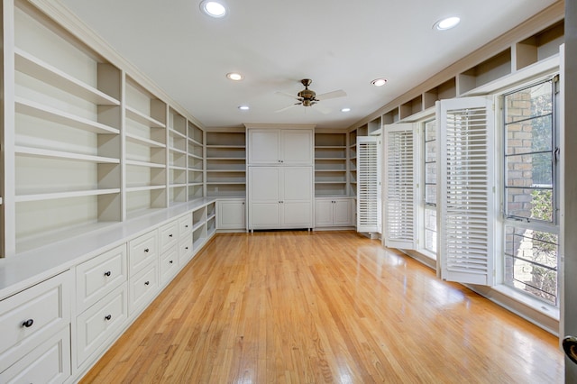 interior space with light wood-style floors and a ceiling fan