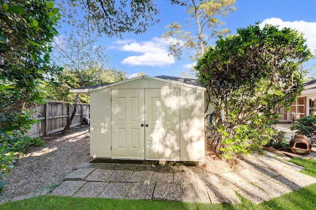 view of shed with a fenced backyard