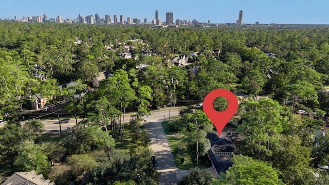 drone / aerial view with a forest view and a view of city