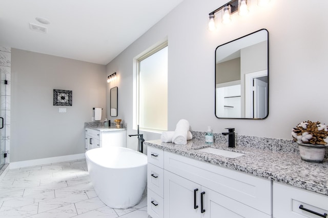 bathroom featuring a soaking tub, two vanities, a sink, a stall shower, and marble finish floor