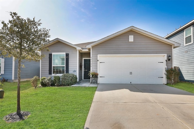 ranch-style house featuring an attached garage, driveway, and a front lawn