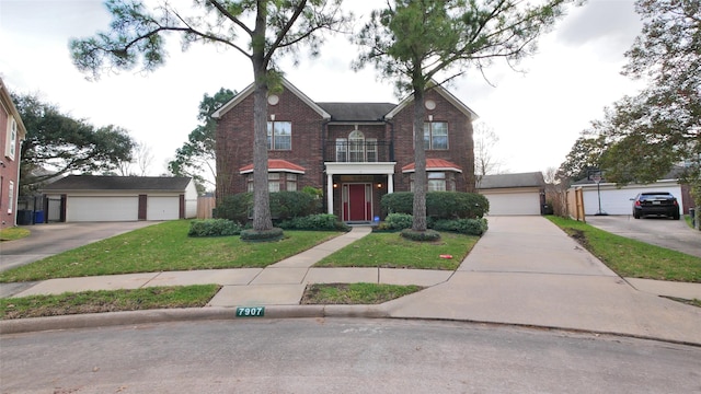 view of front of house featuring a garage, a front yard, and brick siding