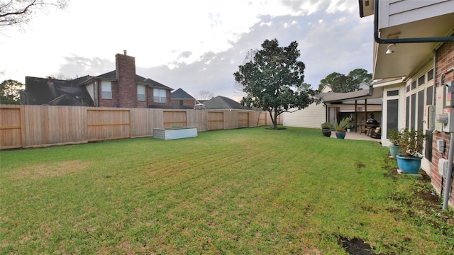 view of yard with a fenced backyard and a patio