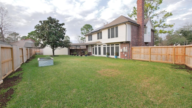 view of yard with a fenced backyard