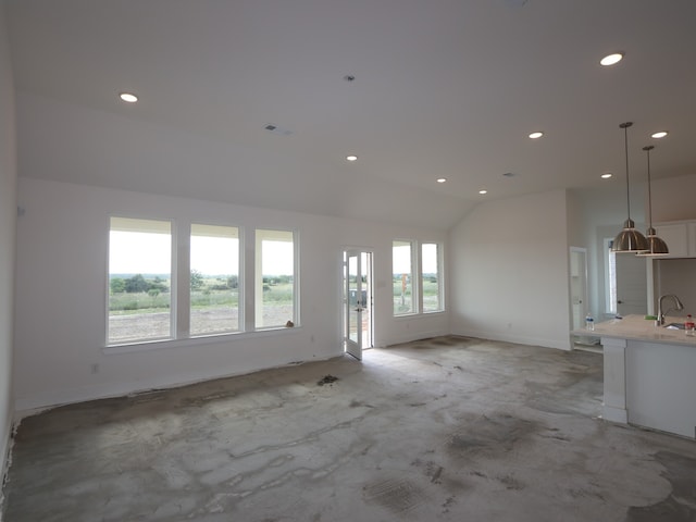8311 Oceanmist Cove Dr, Cypress, TX 77433 - unfurnished living room with recessed lighting, a sink, vaulted ceiling, and baseboards