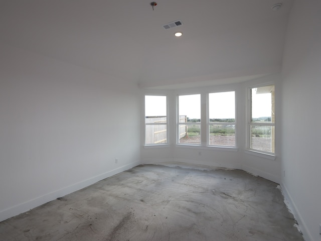 8311 Oceanmist Cove Dr, Cypress, TX 77433 - spare room featuring baseboards, unfinished concrete floors, and a smoke detector