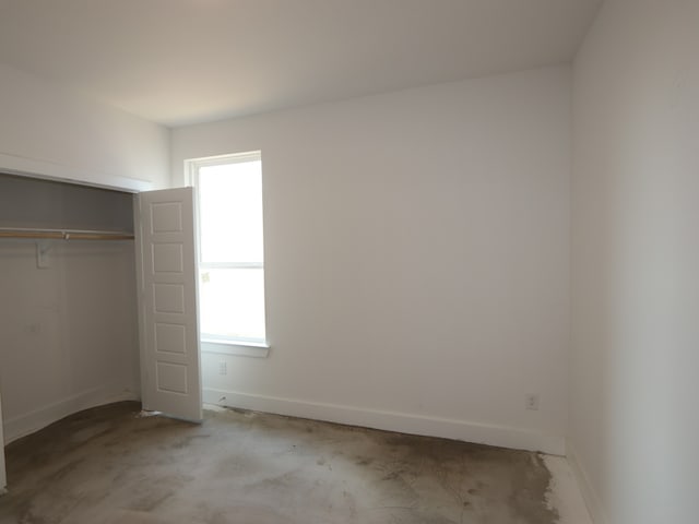 8311 Oceanmist Cove Dr, Cypress, TX 77433 - unfurnished bedroom featuring baseboards and a closet