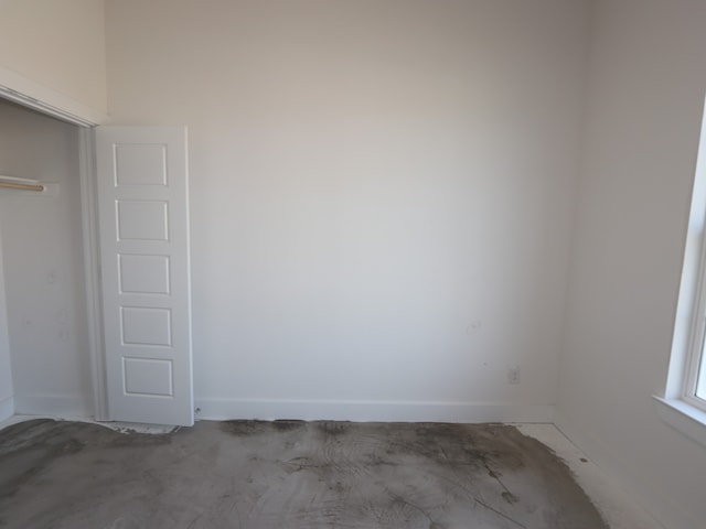 8311 Oceanmist Cove Dr, Cypress, TX 77433 - unfurnished bedroom featuring baseboards and a closet