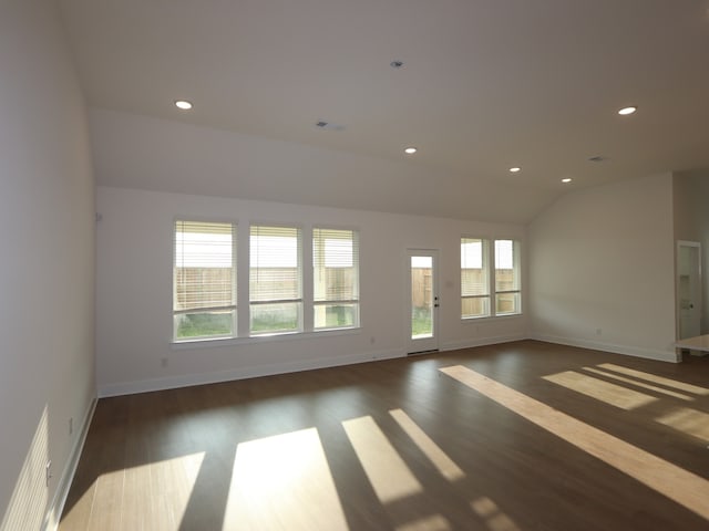 8311 Oceanmist Cove Dr, Cypress, TX 77433 - empty room featuring wood finished floors, baseboards, lofted ceiling, and recessed lighting