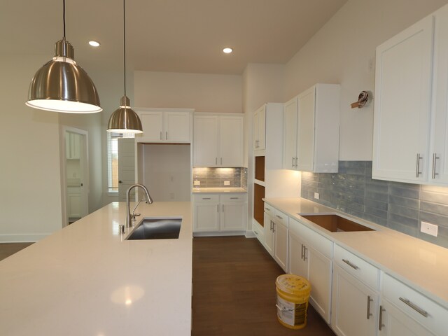 8311 Oceanmist Cove Dr, Cypress, TX 77433 - kitchen with a sink, white cabinetry, tasteful backsplash, pendant lighting, and recessed lighting