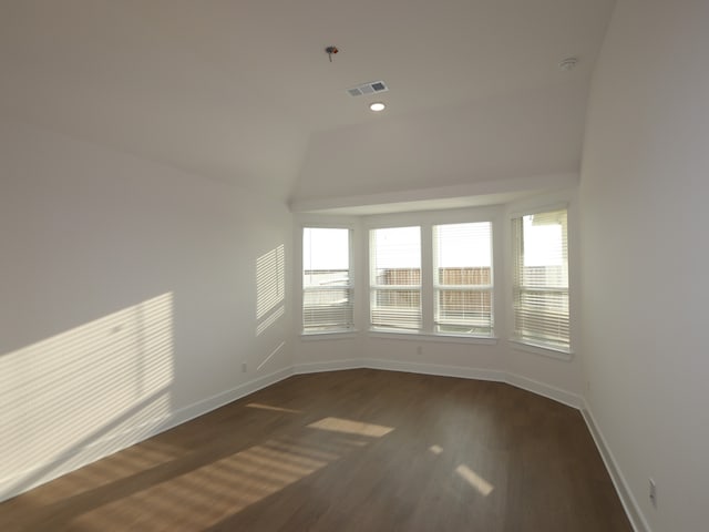 8311 Oceanmist Cove Dr, Cypress, TX 77433 - spare room with dark wood-style floors, plenty of natural light, baseboards, lofted ceiling, and recessed lighting