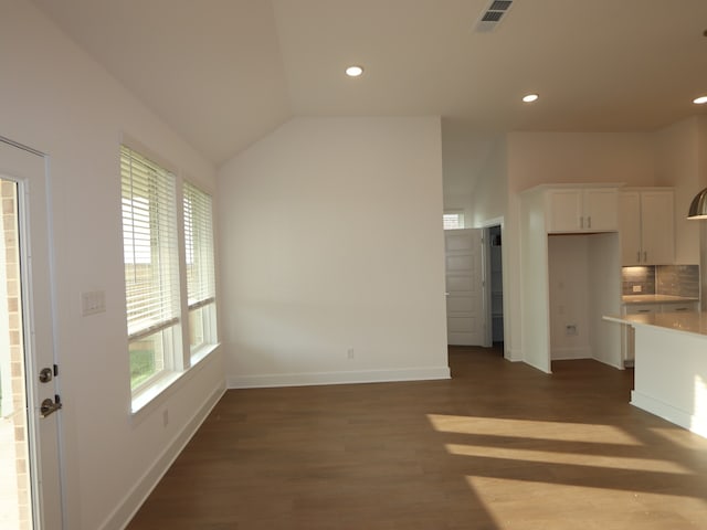 8311 Oceanmist Cove Dr, Cypress, TX 77433 - unfurnished living room with healthy amount of natural light, dark wood-style flooring, recessed lighting, baseboards, and lofted ceiling