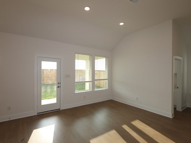 8311 Oceanmist Cove Dr, Cypress, TX 77433 - spare room featuring dark wood-type flooring, baseboards, lofted ceiling, and recessed lighting