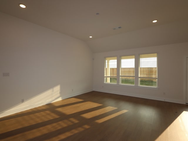 8311 Oceanmist Cove Dr, Cypress, TX 77433 - spare room featuring baseboards, wood finished floors, recessed lighting, and vaulted ceiling