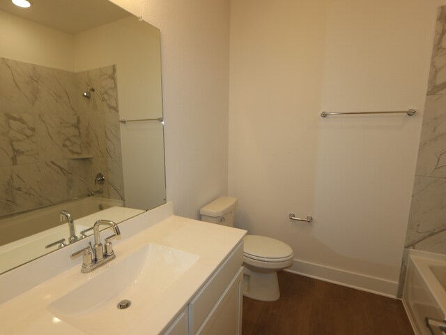 8311 Oceanmist Cove Dr, Cypress, TX 77433 - bathroom with vanity, wood finished floors, toilet, and tub / shower combination