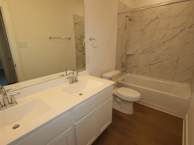 8311 Oceanmist Cove Dr, Cypress, TX 77433 - bathroom featuring double vanity, shower / washtub combination, wood finished floors, and toilet