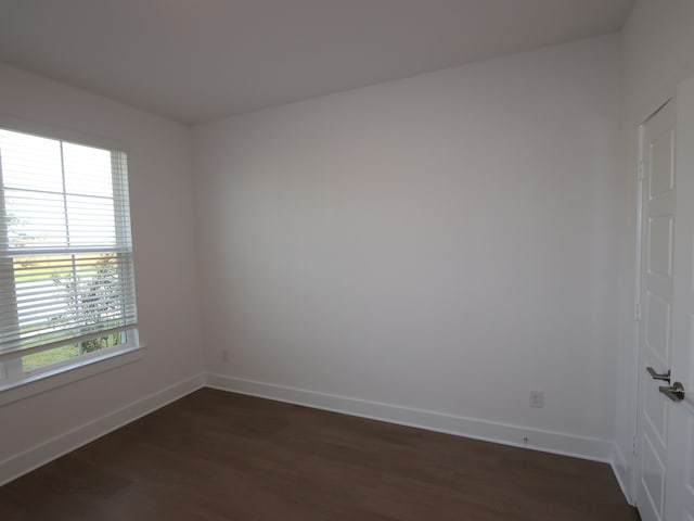 8311 Oceanmist Cove Dr, Cypress, TX 77433 - spare room with dark wood finished floors, healthy amount of natural light, and baseboards