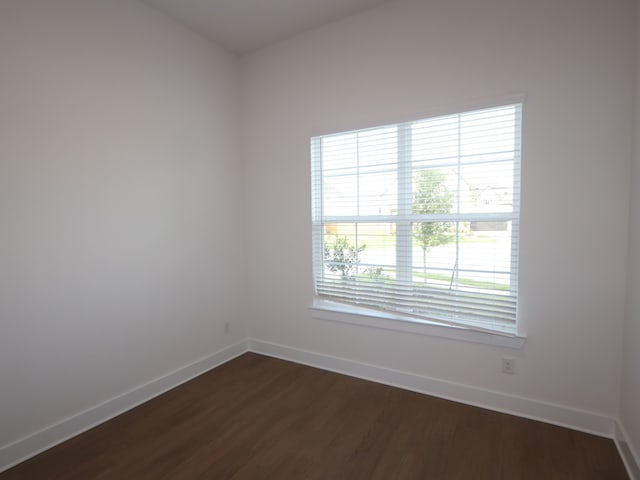 8311 Oceanmist Cove Dr, Cypress, TX 77433 - spare room featuring baseboards and dark wood-type flooring