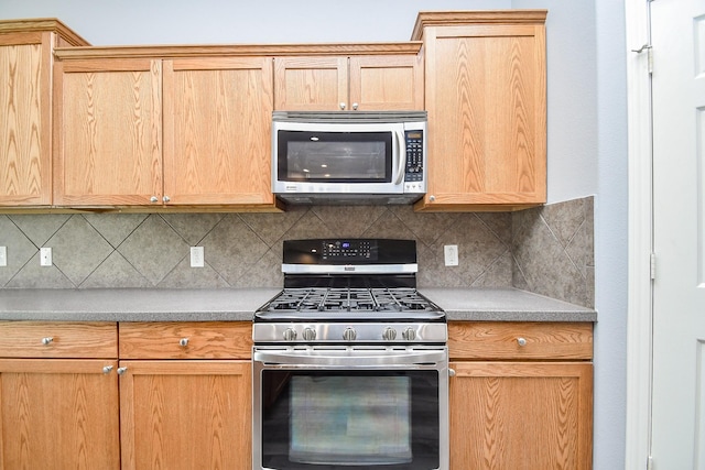 kitchen with tasteful backsplash, light brown cabinets, and stainless steel appliances